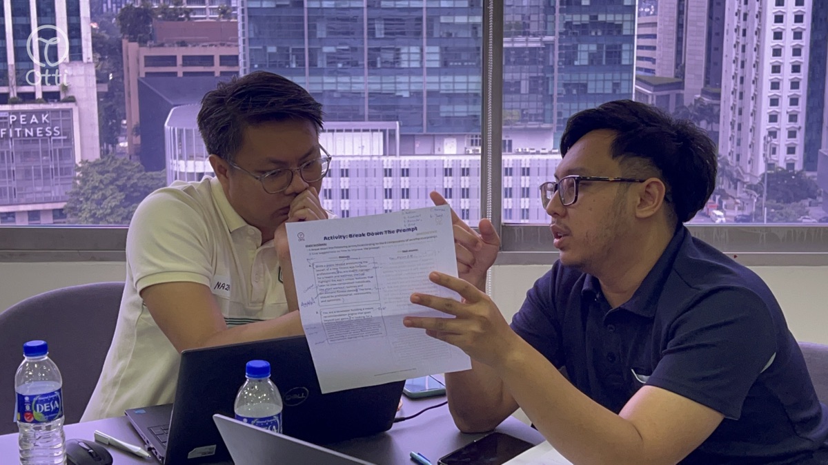 Two professionals reviewing compliance paperwork together